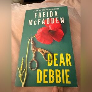 Dear Debbie book with red poppy on teal cover